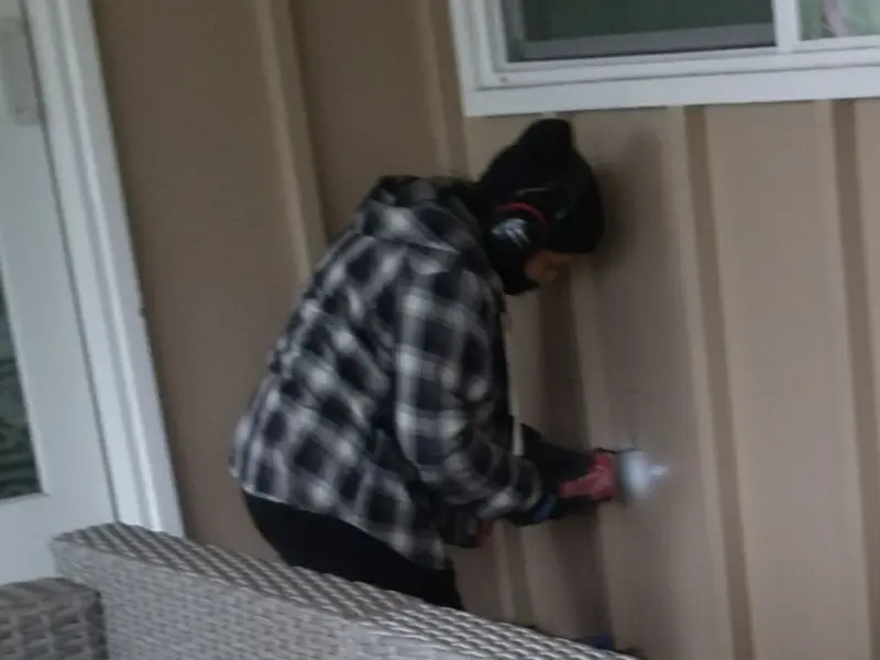 Professional electrician installing an exterior outlet in Pulaski
