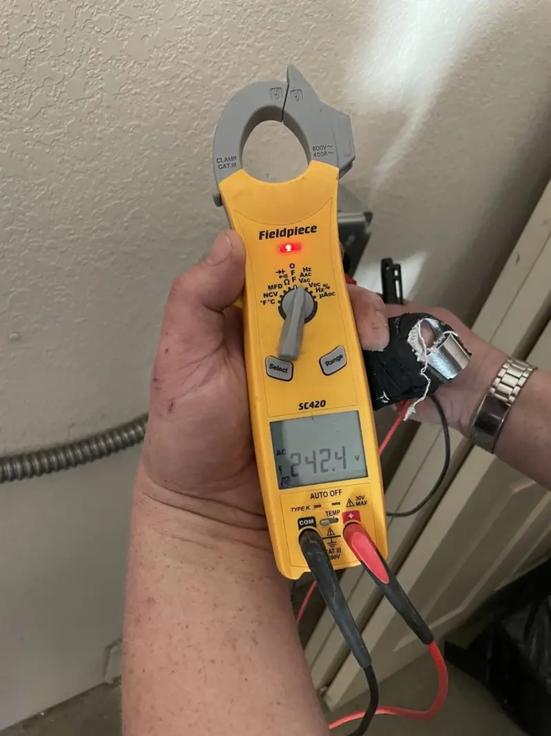 Voltage testing with clamp meter during Electrical Installation Services in Pulaski